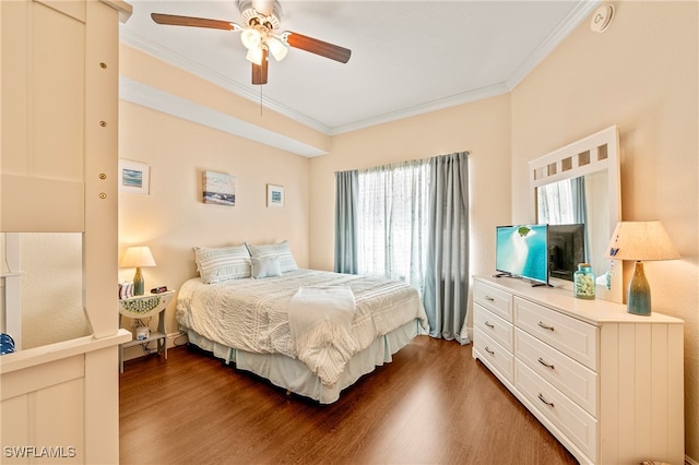 bedroom with ceiling fan, crown molding, and dark hardwood / wood-style flooring