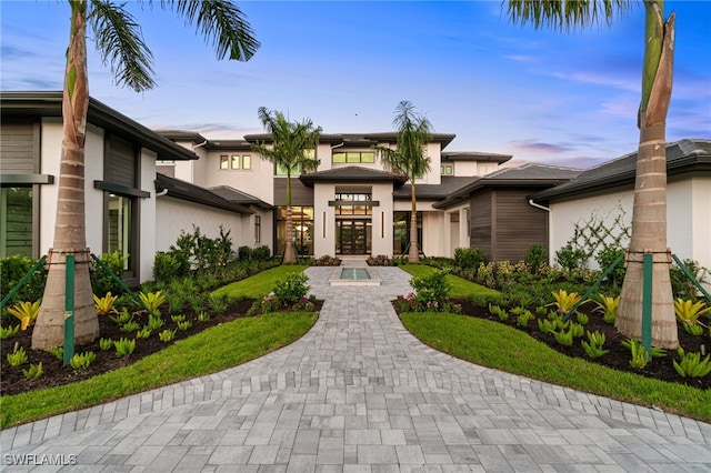 796 Cassena Rd, Naples, FL 34108 - view of front of property featuring stucco siding and french doors