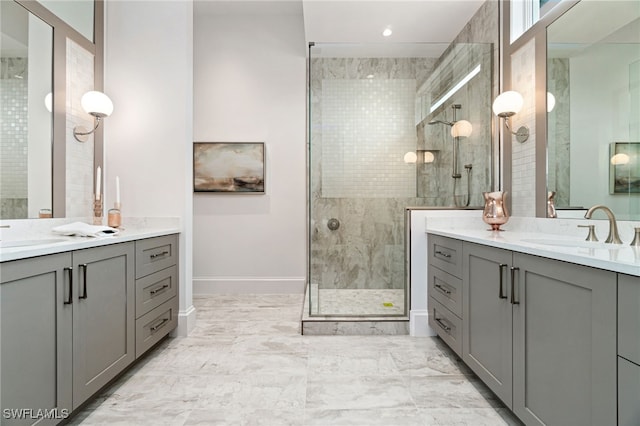 bathroom featuring vanity and a shower with shower door