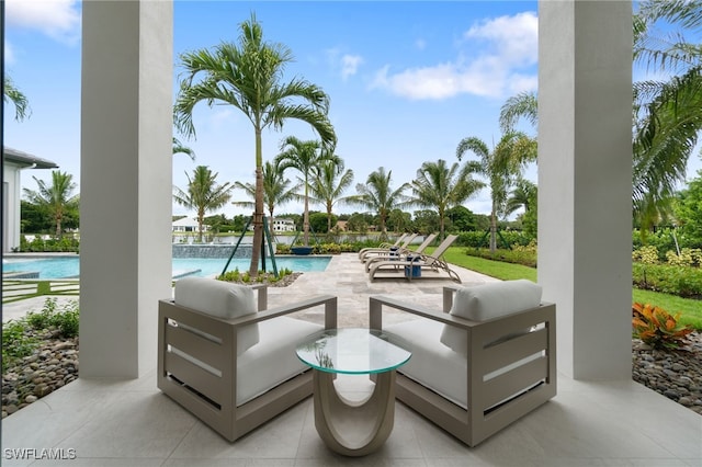 view of patio featuring an outdoor living space and a community pool