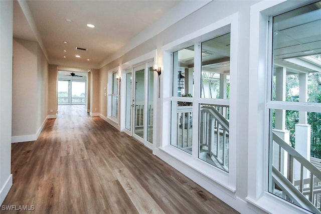 corridor featuring wood-type flooring