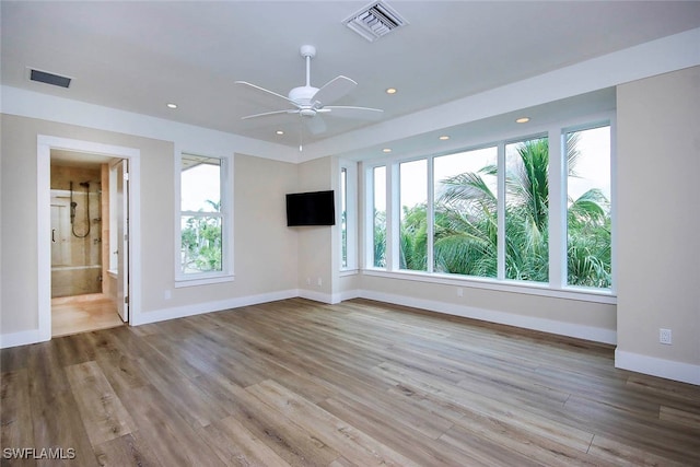 spare room with ceiling fan and light hardwood / wood-style flooring