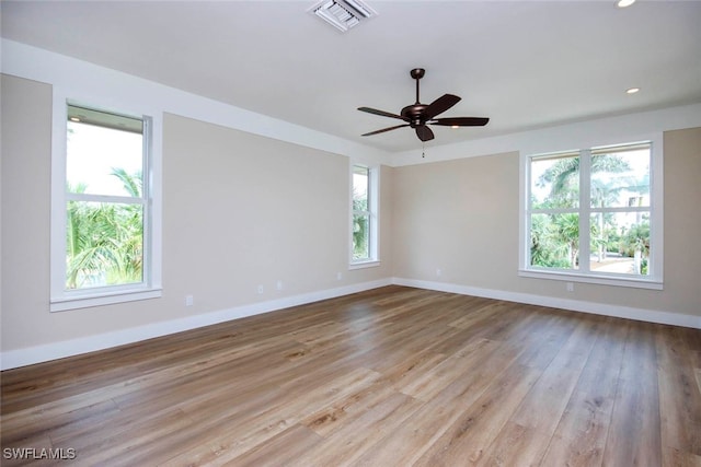 unfurnished room with ceiling fan and light wood-type flooring