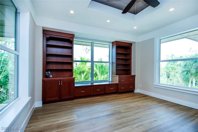 spare room with ceiling fan and light hardwood / wood-style flooring