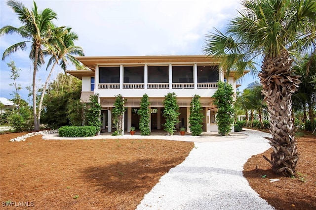 view of front of house featuring a sunroom