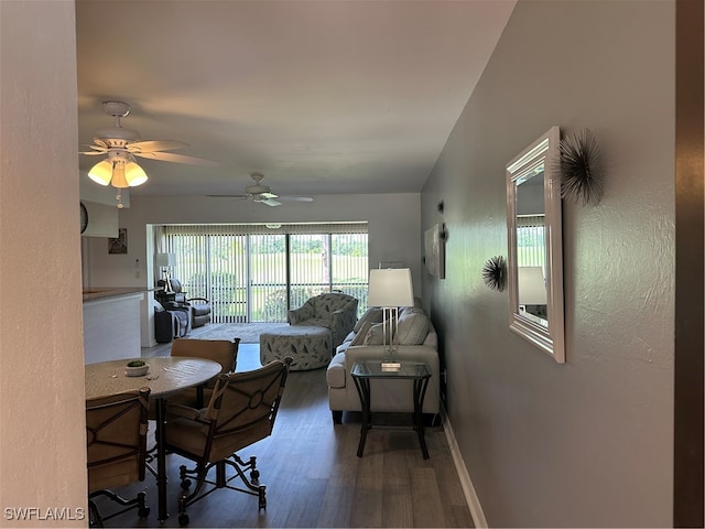 interior space featuring ceiling fan and dark wood-type flooring