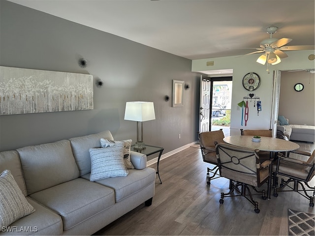 dining room featuring ceiling fan and wood-type flooring