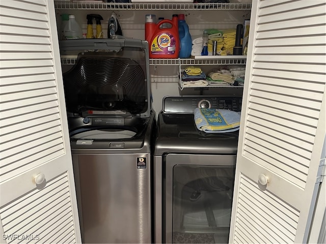 clothes washing area featuring washing machine and dryer