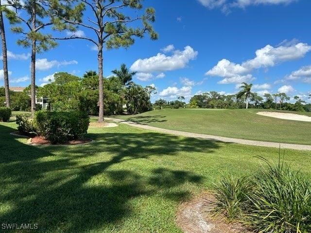 surrounding community featuring a lawn