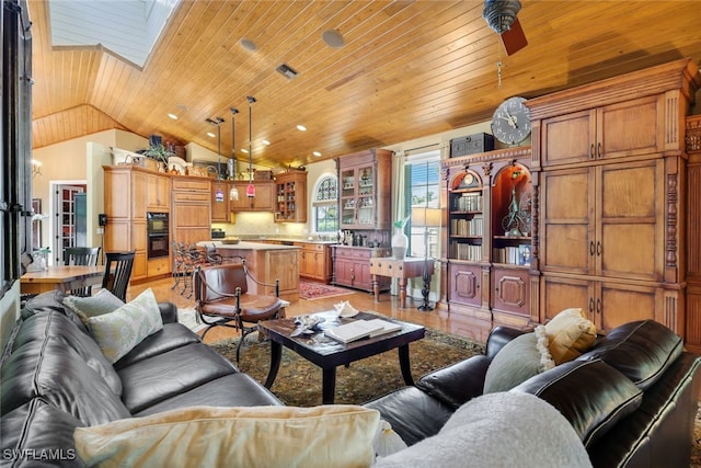 living room with ceiling fan, light wood-type flooring, lofted ceiling with skylight, and wood ceiling