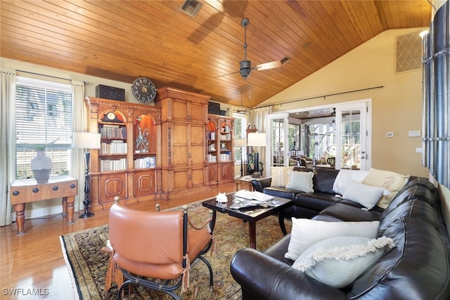 living room with wood ceiling, light wood-type flooring, lofted ceiling, and ceiling fan