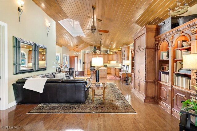 living room featuring wood ceiling, light wood-type flooring, and ceiling fan