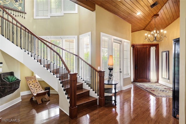 entryway with an inviting chandelier, high vaulted ceiling, wooden ceiling, and dark wood-type flooring