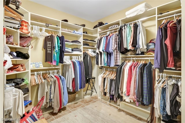 walk in closet featuring light tile patterned floors