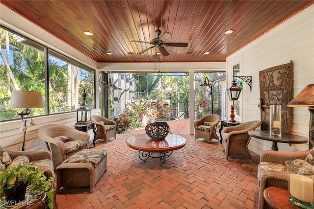 sunroom / solarium with wooden ceiling and ceiling fan