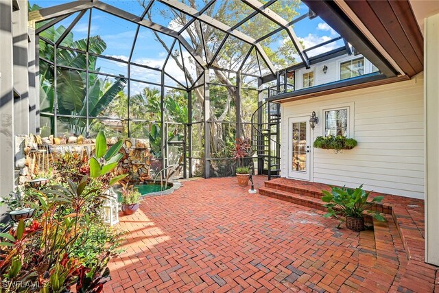 view of patio with glass enclosure