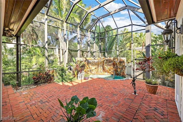 view of patio featuring a lanai