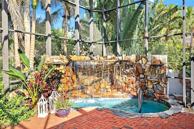 view of swimming pool featuring pool water feature