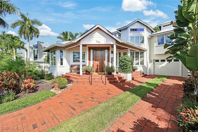 back of property featuring a garage