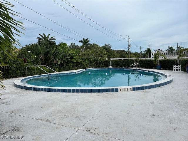 view of pool with a patio area