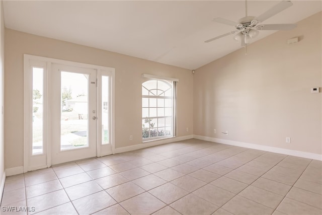 spare room featuring ceiling fan, plenty of natural light, and light tile patterned floors