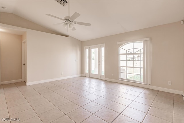 tiled empty room with lofted ceiling and ceiling fan