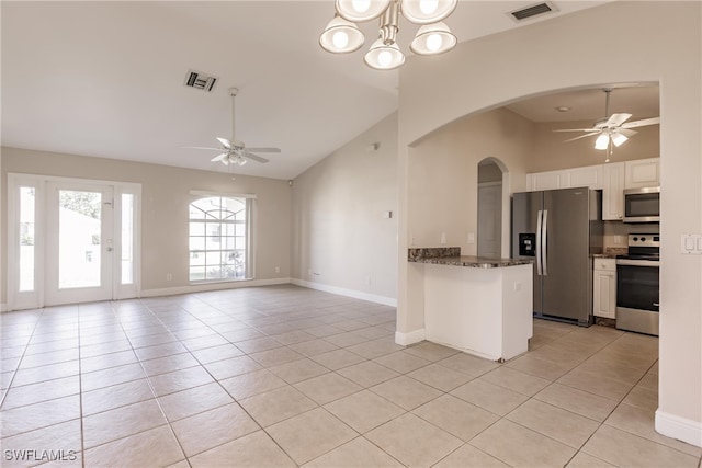 kitchen with white cabinets, ceiling fan with notable chandelier, and stainless steel appliances