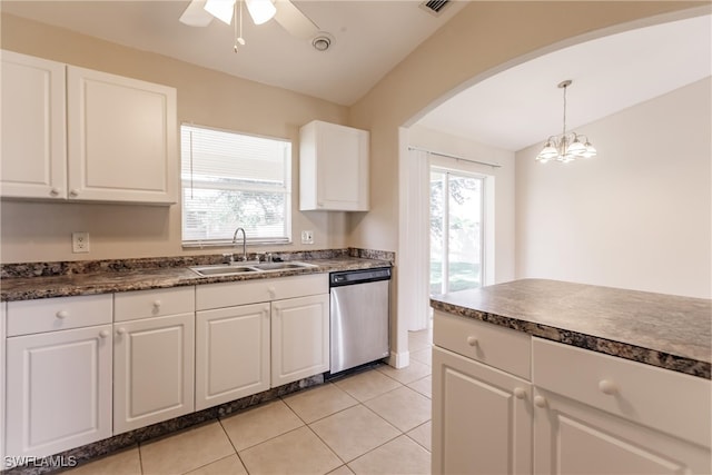 kitchen with white cabinets, hanging light fixtures, sink, stainless steel dishwasher, and ceiling fan with notable chandelier