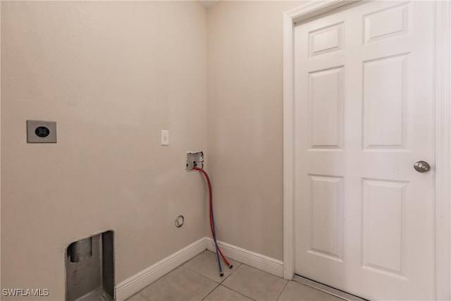 clothes washing area featuring hookup for a washing machine, hookup for an electric dryer, and light tile patterned floors