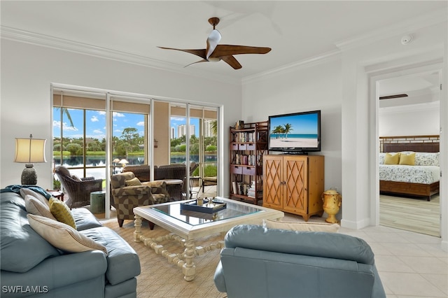 living room featuring ceiling fan, light tile patterned floors, and crown molding