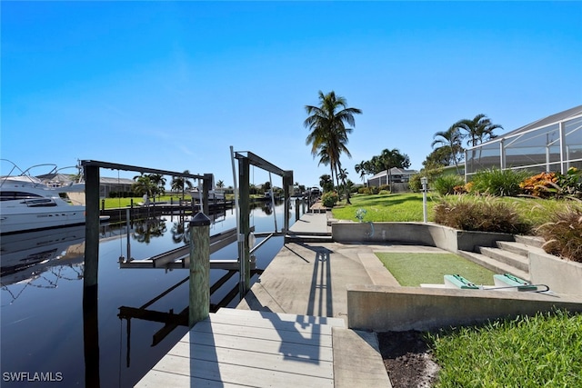 dock area featuring a lanai and a water view