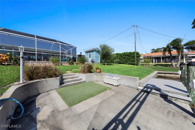 view of yard with a patio and glass enclosure