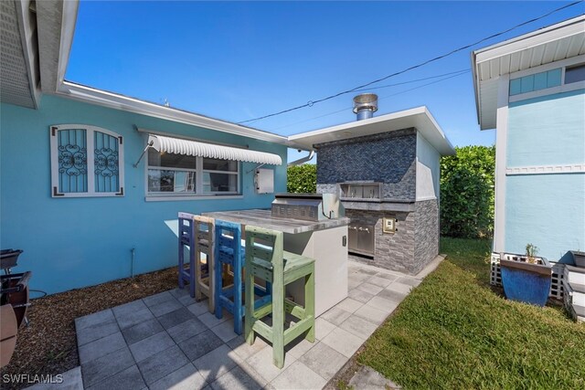 view of patio / terrace featuring exterior kitchen and grilling area