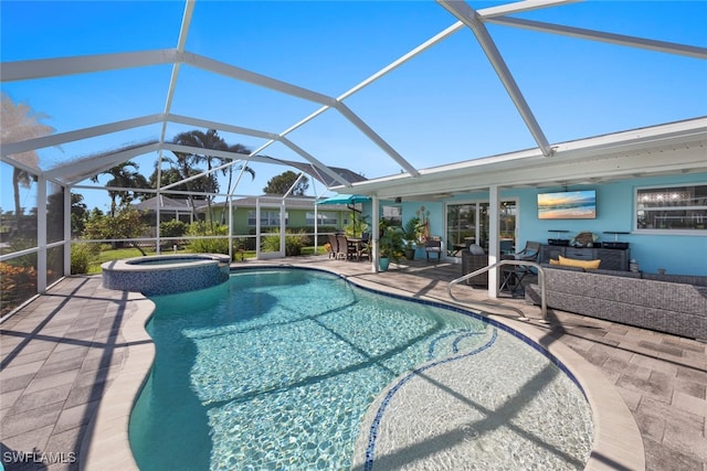 view of pool featuring an in ground hot tub, a patio, and a lanai