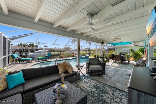 view of patio / terrace with outdoor lounge area, ceiling fan, and a lanai