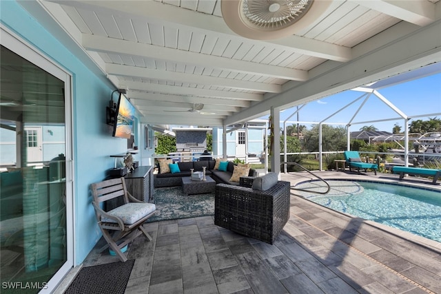 view of patio / terrace featuring outdoor lounge area, ceiling fan, and a lanai