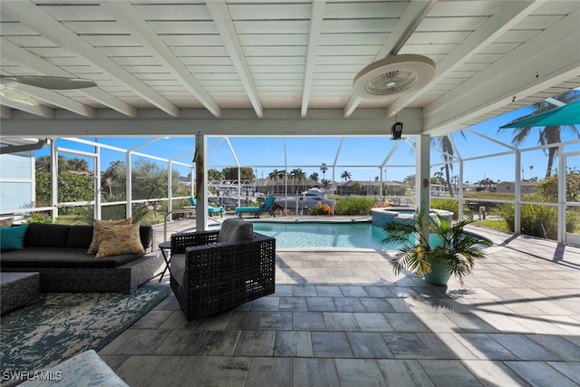 view of pool featuring an in ground hot tub, a patio area, a lanai, and an outdoor living space