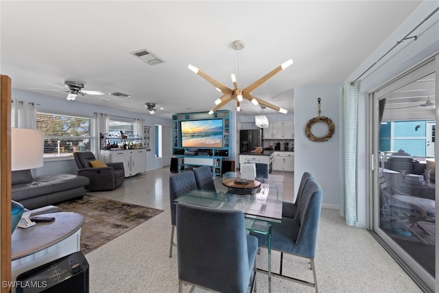 dining space with ceiling fan