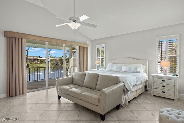 bedroom with multiple windows, access to outside, and vaulted ceiling