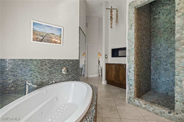 bathroom featuring shower with separate bathtub and tile patterned floors