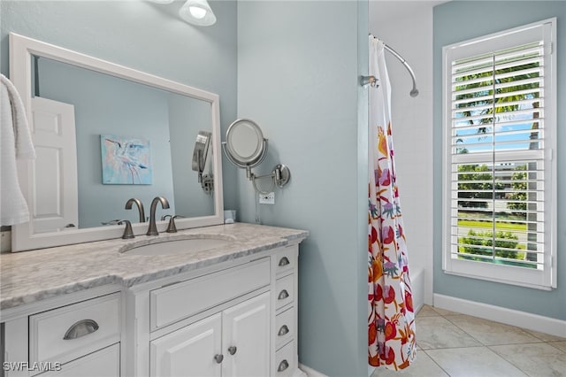 bathroom featuring tile patterned flooring, vanity, and shower / tub combo with curtain