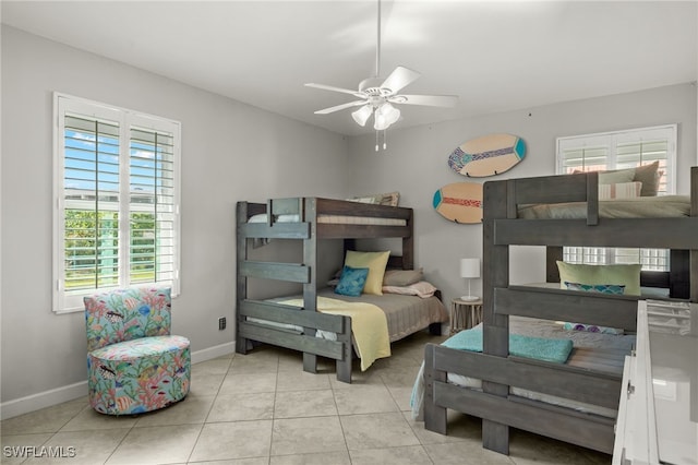 tiled bedroom with ceiling fan