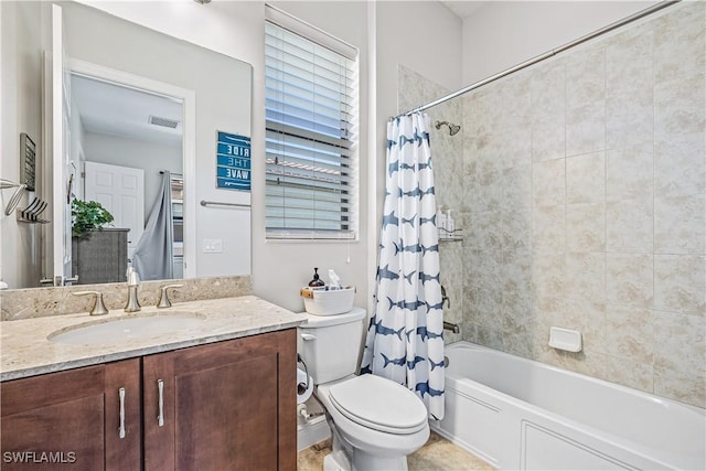 full bathroom featuring vanity, toilet, and shower / tub combo