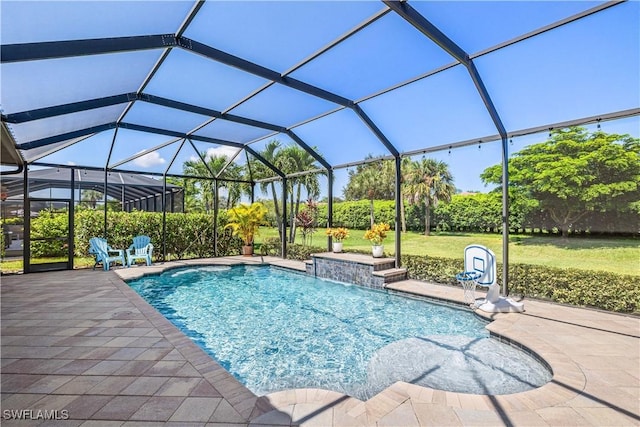 view of swimming pool with pool water feature, a patio area, and glass enclosure