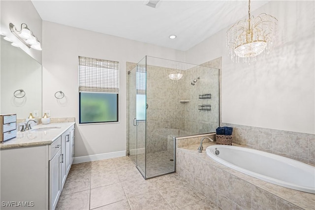 bathroom with vanity, plus walk in shower, a chandelier, and tile patterned flooring