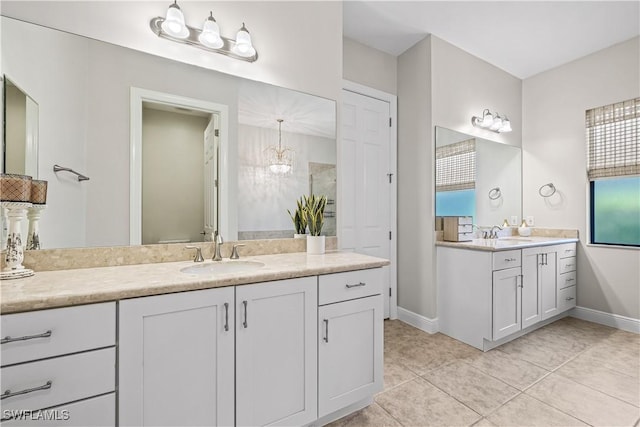 bathroom with tile patterned flooring and vanity