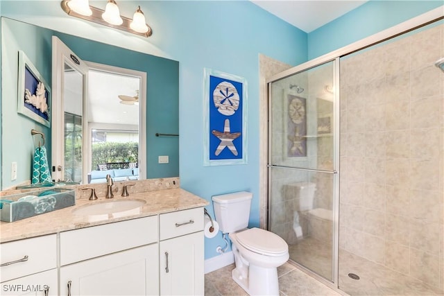 bathroom with an enclosed shower, vanity, tile patterned floors, and toilet