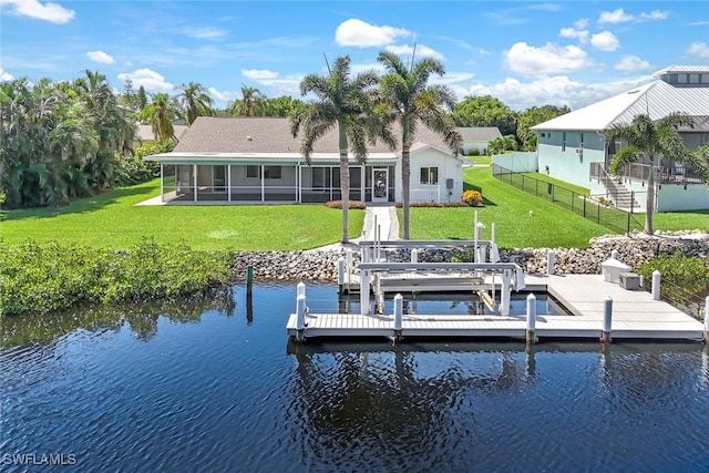 dock area featuring a yard and a water view