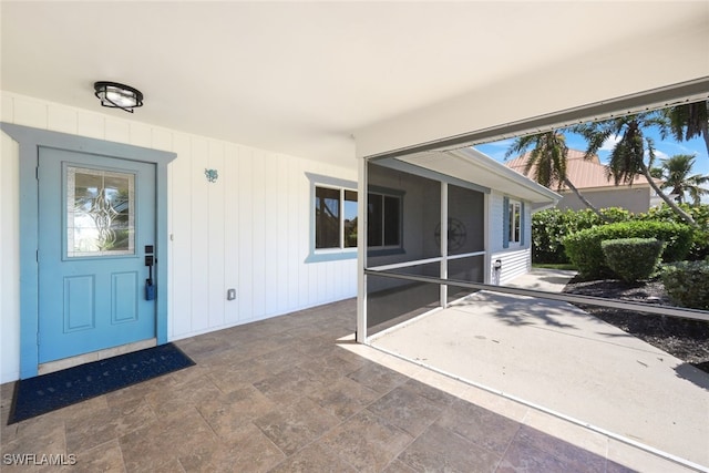 property entrance featuring a patio