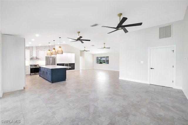 kitchen featuring white cabinetry, ceiling fan, stainless steel appliances, and blue cabinetry